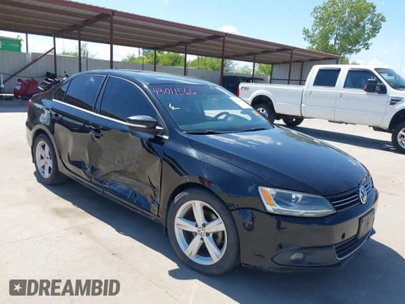 ✅ 2012 Volkswagen Jetta TDI w/Premium & Nav • VIN: 3VWLL7AJ0CM410008 • Lot: 43011566. Listed on IAAI with 207,018 mi. Free auction sales archive from the USA and detailed vehicle history report at DreamBid. Image 1.