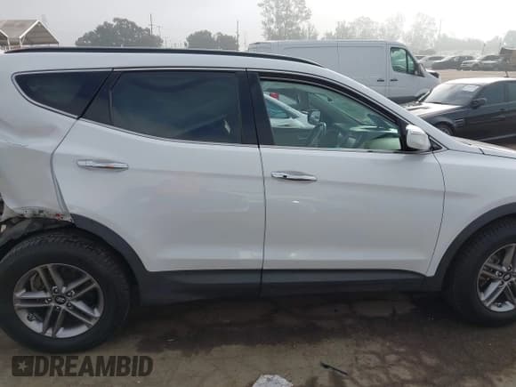 ✅ 2017 Hyundai Santa Fe 2.4L • VIN: 5NMZU3LB3HH034679 • Лот: 43585420. Опубликован ранее на IAAI с пробегом 98 763 миль. Бесплатный доступ к архиву аукционных продаж из США и подробный отчёт об истории автомобиля на DreamBid. Изображение 13.