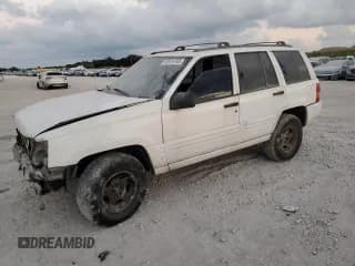 ✅ 1998 Jeep Grand Cherokee Laredo • VIN: 1J4GZ48S8WC313204 • Lot: 93124765. Listed on Copart with Not provided. Free auction sales archive from the USA and detailed vehicle history report at DreamBid. Image 1.