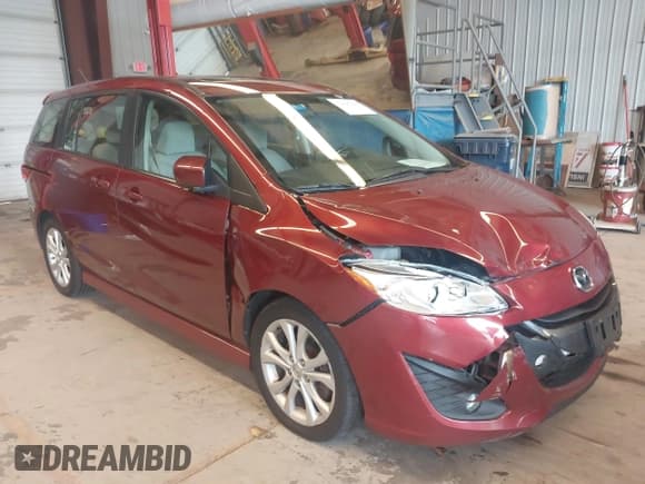 ✅ 2012 Mazda 5 Touring • VIN: JM1CW2CL3C0136544 • Lot: 42696240. Listed on IAAI with 77,400 mi. Free auction sales archive from the USA and detailed vehicle history report at DreamBid. Image 1.