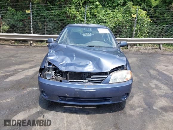✅ 2002 Kia Spectra • VIN: KNAFB121025143629 • Lot: 42361982. Listed on IAAI with 171,393 mi. Free auction sales archive from the USA and detailed vehicle history report at DreamBid. Image 12.