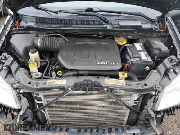 2014 Dodge Grand Caravan SE with VIN 2C4RDGBG9ER476016, listed as a Copart auction lot 85492545 with 243,479 mi miles and Salvage title. Bid and sale history available at DreamBid. Image 12.