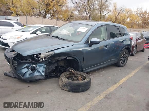 ✅ 2016 Mazda CX-5 Grand Touring • VIN: JM3KE4DY0G0790824 • Lot: 43736594. Wystawiony na IAAI z przebiegiem Nie podano. Bezpłatny archiwum sprzedaży aukcyjnych z USA i szczegółowy raport historii pojazdu na DreamBid. Zdjęcie 17.