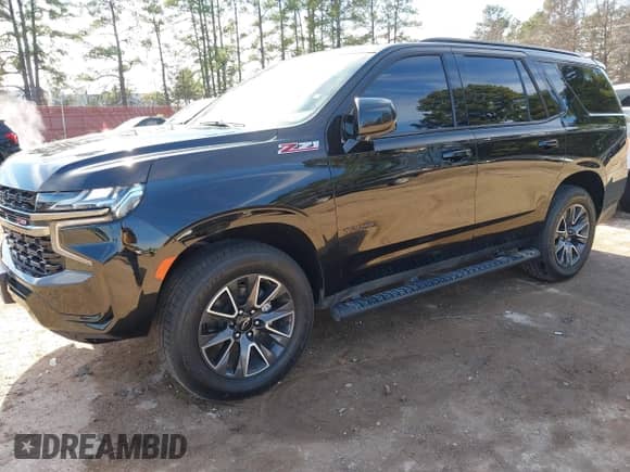 2022 Chevrolet Tahoe Z71 z VIN 1GNSKPKD1NR185780, wystawiony jako IAAI lot #41301544 z przebiegiem 54 359 mil mil oraz . Historia ofert i sprzedaży dostępna na DreamBid. Obrazek 17.