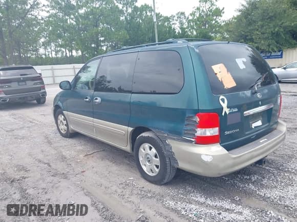 ✅ 2003 Kia Sedona LX • VIN: KNDUP131736487304 • Lot: 42915081. Listed on IAAI with 180,003 mi. Free auction sales archive from the USA and detailed vehicle history report at DreamBid. Image 1.