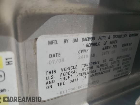 2009 Chevrolet Aveo 1LT with VIN KL1TD66E09B338773, listed as a Copart auction lot 52575765 with 102,617 mi miles and Salvage title. Bid and sale history available at DreamBid. Image 12.