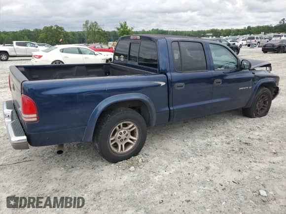 2002 Dodge Dakota SLT z VIN 1B7HL48X92S548573, wystawiony jako Copart lot #55357085 z przebiegiem 252 742 mil mil oraz Szkoda całkowita • Salvage title. Historia ofert i sprzedaży dostępna na DreamBid. Obrazek 3.