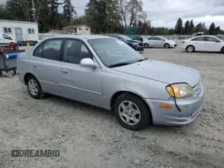 2005 Hyundai Accent GLS z VIN KMHCG45C75U639281, wystawiony jako Copart lot #54887095 z przebiegiem 136 090 mil mil oraz Szkoda całkowita • Salvage title. Historia ofert i sprzedaży dostępna na DreamBid. Obrazek 4.