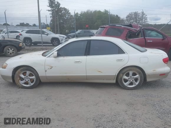 ✅ 2002 Mazda Millenia • VIN: JM1TA221621738040 • Lot: 40597747. Wystawiony na IAAI z przebiegiem Nie podano. Bezpłatny archiwum sprzedaży aukcyjnych z USA i szczegółowy raport historii pojazdu na DreamBid. Zdjęcie 14.