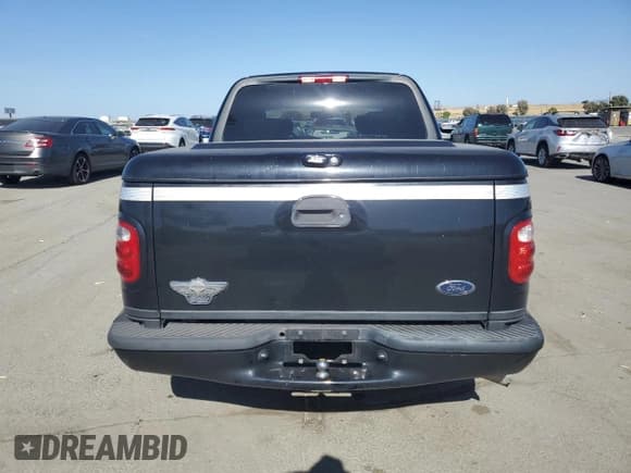 ✅ 2003 Ford F-150 Harley-Davidson • VIN: 1FTRW07373KC44985 • Lot: 58571585. Listed on Copart with 202,249 mi. Free auction sales archive from the USA and detailed vehicle history report at DreamBid. Image 6.