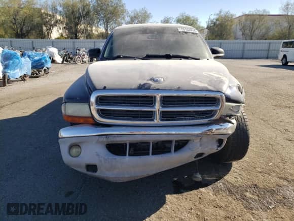 2004 Dodge Dakota SLT z VIN 1D7HL48N44S500485, wystawiony jako Copart lot #73153244 z przebiegiem Nie podano mil oraz Szkoda całkowita • Salvage title. Historia ofert i sprzedaży dostępna na DreamBid. Obrazek 5.