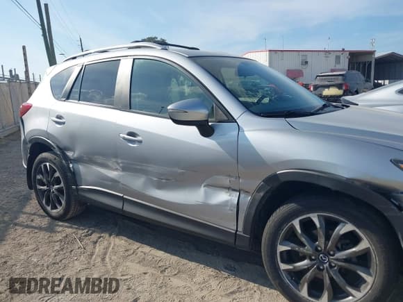 ✅ 2016 Mazda CX-5 Grand Touring • VIN: JM3KE4DY0G0856658 • Lot: 43778076. Wystawiony na IAAI z przebiegiem 103 388 mil. Bezpłatny archiwum sprzedaży aukcyjnych z USA i szczegółowy raport historii pojazdu na DreamBid. Zdjęcie 6.