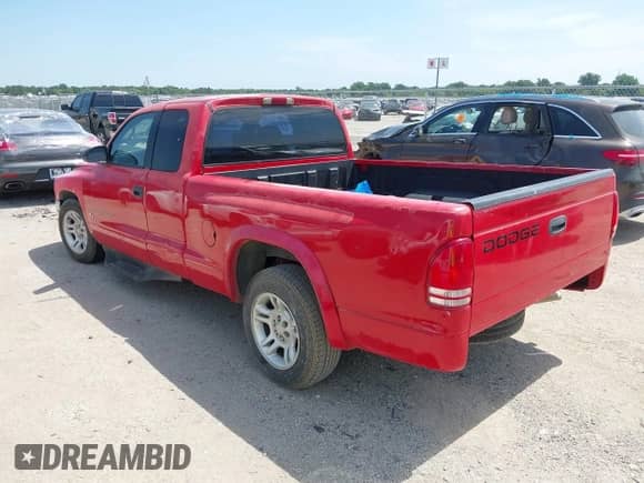 2002 Dodge Dakota Sport z VIN 1B7GL32X12S658855, wystawiony jako IAAI lot #42680702 z przebiegiem 133 507 mil mil oraz . Historia ofert i sprzedaży dostępna na DreamBid. Obrazek 3.