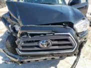 ✅ 2023 Toyota Tacoma SR5 • VIN: 3TMAZ5CN0PM219028 • Lot: 52050355. Listed on Copart with 31,371 mi. Free auction sales archive from the USA and detailed vehicle history report at DreamBid. Image 13.