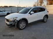 ✅ 2016 Mazda CX-5 Touring • VIN: JM3KE2CY1G0642719 • Lot: 92092345. Listed on Copart with 148,428 mi. Free auction sales archive from the USA and detailed vehicle history report at DreamBid. Image 1.
