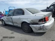 ✅ 2003 Kia Optima LX • VIN: KNAGD126535218790 • Lot: 51278425. Listed on Copart with 255,961 mi. Free auction sales archive from the USA and detailed vehicle history report at DreamBid. Image 2.