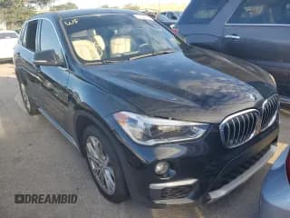 ✅ 2018 BMW X1 xDrive28i • VIN: WBXHT3C37J5K27694 • Lot: 64022772. Listed on Copart with 59,413 mi. Free auction sales archive from the USA and detailed vehicle history report at DreamBid. Image 1.