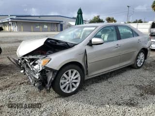 ✅ 2013 Toyota Camry XLE • VIN: 4T1BD1FKXDU077688 • Lot: 93349255. Listed on Copart with 136,926 mi. Free auction sales archive from the USA and detailed vehicle history report at DreamBid. Image 1.