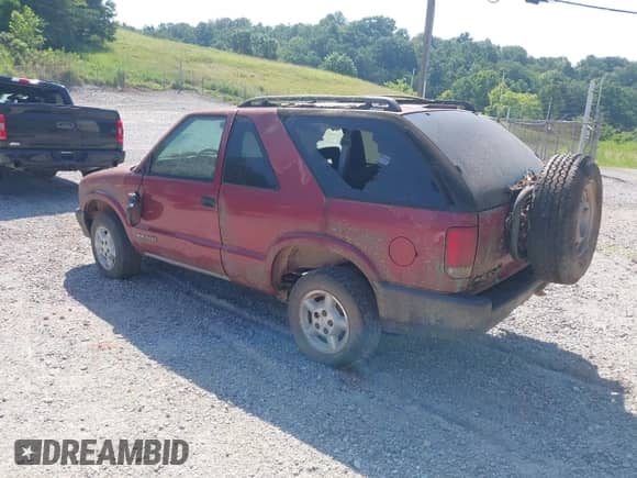 1997 Chevrolet Blazer LS z VIN 1GNCT18W7VK136406, wystawiony jako IAAI lot #42574267 z przebiegiem 185 908 mil mil oraz . Historia ofert i sprzedaży dostępna na DreamBid. Obrazek 3.