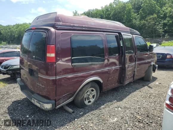 2003 Chevrolet Express Passenger with VIN 1GBFG15X431233061, listed as a Copart auction lot 62646375 with Not provided miles and Salvage title. Bid and sale history available at DreamBid. Image 3.