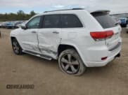 ✅ 2014 Jeep Grand Cherokee Overland • VIN: 1C4RJFCG3EC502765 • Лот: 90049505. Опубликован ранее на Copart с пробегом 165 174 миль. Бесплатный доступ к архиву аукционных продаж из США и подробный отчёт об истории автомобиля на DreamBid. Изображение 2.
