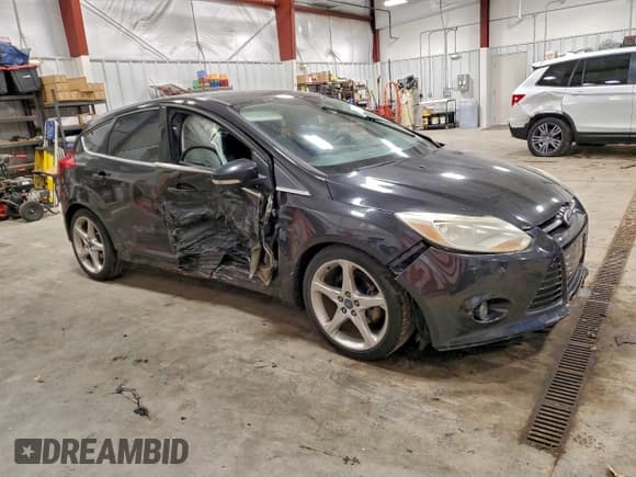 ✅ 2012 Ford Focus Titanium • VIN: 1FAHP3N23CL463608 • Lot: 94284595. Listed on Copart with 142,923 mi. Free auction sales archive from the USA and detailed vehicle history report at DreamBid. Image 4.