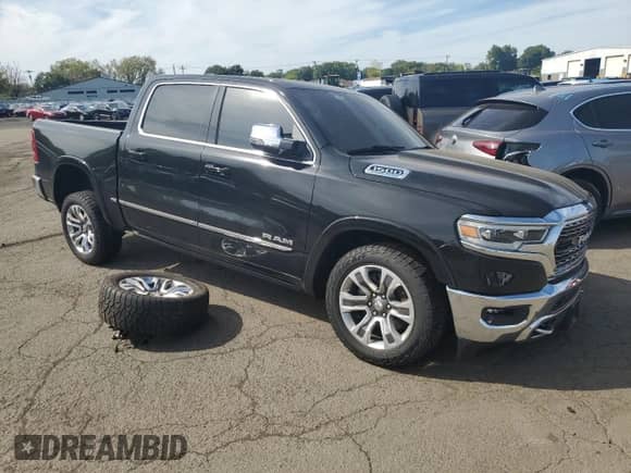 2024 Ram 1500 Limited with VIN 1C6SRFHTXRN109542, listed as a Copart auction lot 84435275 with 59,042 mi miles and Salvage title. Bid and sale history available at DreamBid. Image 4.