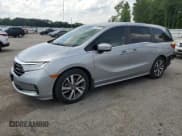 ✅ 2021 Honda Odyssey Touring • VIN: 5FNRL6H85MB039444 • Lot: 57142205. Listed on Copart with 74,228 mi. Free auction sales archive from the USA and detailed vehicle history report at DreamBid. Image 1.