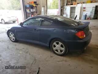 2004 Hyundai Tiburon GS с VIN KMHHM65D74U127053, выставлен на аукционе Copart как лот 84396475 с пробегом 89 271 миль миль и Чистый • Clean title. История ставок и продаж доступна на DreamBid. Изображение 2.