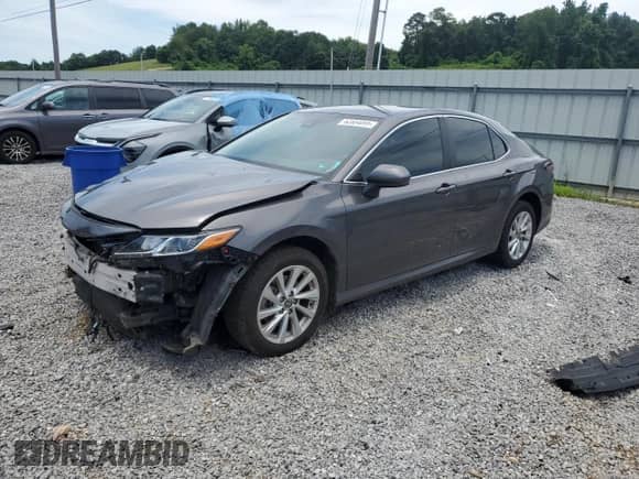 2023 Toyota Camry LE с VIN 4T1C11BK1PU102890, выставлен на аукционе Copart как лот 62864095 с пробегом 67 528 миль миль и Списание • Salvage title. История ставок и продаж доступна на DreamBid. Изображение 1.