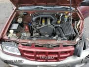 ✅ 2002 Isuzu Rodeo • VIN: 4S2CK58D124323937 • Lot: 86155194. Listed on Copart with 184,491 mi. Free auction sales archive from the USA and detailed vehicle history report at DreamBid. Image 12.