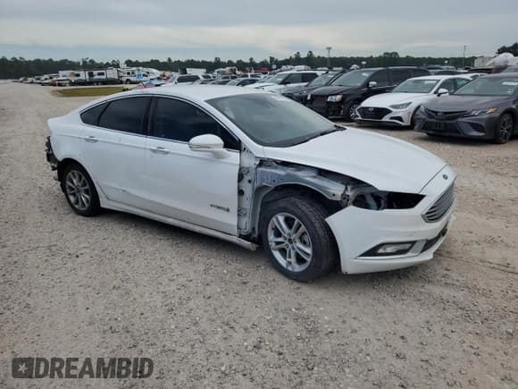 ✅ 2017 Ford Fusion Hybrid SE • VIN: 3FA6P0LU5HR409391 • Lot: 69023164. Listed on Copart with 122,575 mi. Free auction sales archive from the USA and detailed vehicle history report at DreamBid. Image 4.