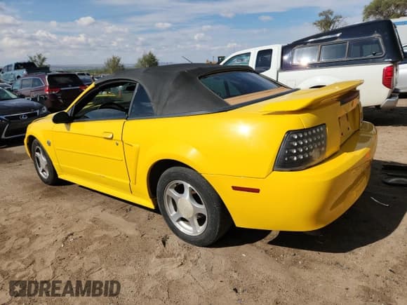 ✅ 2004 Ford Mustang Deluxe • VIN: 1FAFP44684F204775 • Lot: 82301525. Listed on Copart with 229,182 mi. Free auction sales archive from the USA and detailed vehicle history report at DreamBid. Image 2.