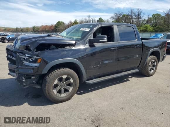 2019 Ram 1500 Rebel z VIN 1C6SRFLT0KN698856, wystawiony jako Copart lot #69225485 z przebiegiem 143 146 mil mil oraz Szkoda całkowita • Salvage title. Historia ofert i sprzedaży dostępna na DreamBid. Obrazek 1.