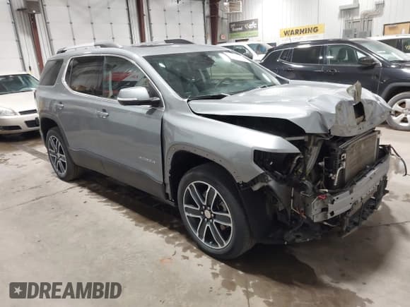 ✅ 2023 GMC Acadia SLT • VIN: 1GKKNULS1PZ191310 • Lot: 43578298. Listed on IAAI with 48,593 mi. Free auction sales archive from the USA and detailed vehicle history report at DreamBid. Image 1.