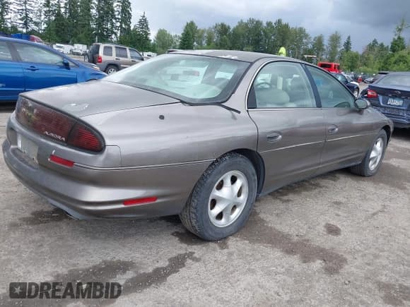 ✅ 1999 Oldsmobile Aurora • VIN: 1G3GR62C0X4118468 • Лот: 42550601. Опубликован ранее на IAAI с пробегом 241 423 миль. Бесплатный доступ к архиву аукционных продаж из США и подробный отчёт об истории автомобиля на DreamBid. Изображение 4.