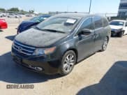 ✅ 2014 Honda Odyssey Touring • VIN: 5FNRL5H99EB051715 • Lot: 43405838. Listed on IAAI with 176,921 mi. Free auction sales archive from the USA and detailed vehicle history report at DreamBid. Image 2.