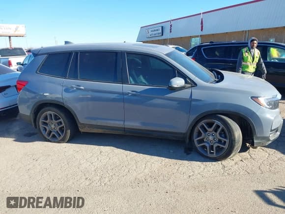 ✅ 2022 Honda Passport EX-L • VIN: 5FNYF7H57NB005716 • Lot: 41078499. Listed on IAAI with 33,141 mi. Free auction sales archive from the USA and detailed vehicle history report at DreamBid. Image 13.