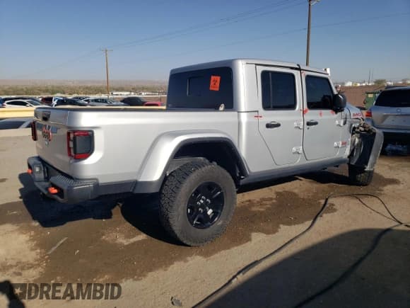 ✅ 2023 Jeep Gladiator Mojave • VIN: 1C6JJTEG9PL587727 • Лот: 52098305. Опубликован ранее на Copart с пробегом 28 776 миль. Бесплатный доступ к архиву аукционных продаж из США и подробный отчёт об истории автомобиля на DreamBid. Изображение 3.