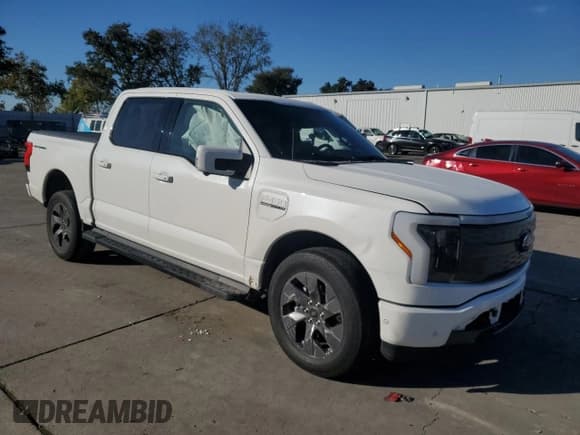 ✅ 2023 Ford F-150 Lightning Lariat • VIN: 1FTVW1EV0PWG12849 • Lot: 87083755. Listed on Copart with 35,557 mi. Free auction sales archive from the USA and detailed vehicle history report at DreamBid. Image 4.