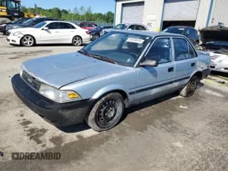 ✅ 1990 Toyota Corolla • VIN: JT2AE94A3L3318946 • Lot: 59189514. Listed on Copart with 115,252 mi. Free auction sales archive from the USA and detailed vehicle history report at DreamBid. Image 1.