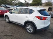 ✅ 2013 Mazda CX-5 Touring • VIN: JM3KE2CEXD0148702 • Lot: 43877352. Listed on IAAI with 183,342 mi. Free auction sales archive from the USA and detailed vehicle history report at DreamBid. Image 3.