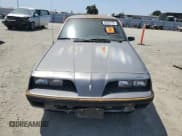✅ 1985 Pontiac Sunbird • VIN: 1G2JB350XF7575719 • Lot: 60540725. Listed on Copart with 60,511 mi. Free auction sales archive from the USA and detailed vehicle history report at DreamBid. Image 5.