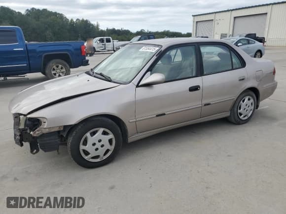 ✅ 1999 Toyota Corolla LE • VIN: 1NXBR12E6XZ148570 • Лот: 81554415. Опубликован ранее на Copart с пробегом 264 960 миль. Бесплатный доступ к архиву аукционных продаж из США и подробный отчёт об истории автомобиля на DreamBid. Изображение 1.