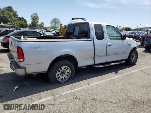 ✅ 2001 Ford F-150 XL • VIN: 1FTRX17L71KA17165 • Lot: 57982675. Listed on Copart with Not provided. Free auction sales archive from the USA and detailed vehicle history report at DreamBid. Image 3.