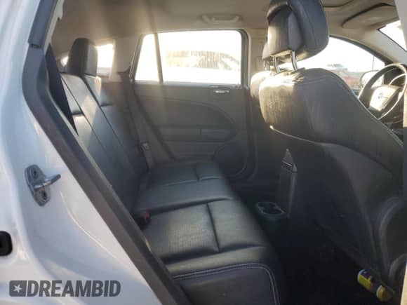 2011 Dodge Caliber Uptown z VIN 1B3CB9HA8BD269272, wystawiony jako Copart lot #42624035 z przebiegiem 143 054 mil mil oraz Szkoda całkowita • Salvage title. Historia ofert i sprzedaży dostępna na DreamBid. Obrazek 10.