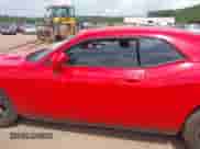 2014 Dodge Challenger SXT 100th Anniversary with VIN 2C3CDYAG0EH285477, listed as a IAAI auction lot 42298675 with 128,684 mi miles and . Bid and sale history available at DreamBid. Image 14.