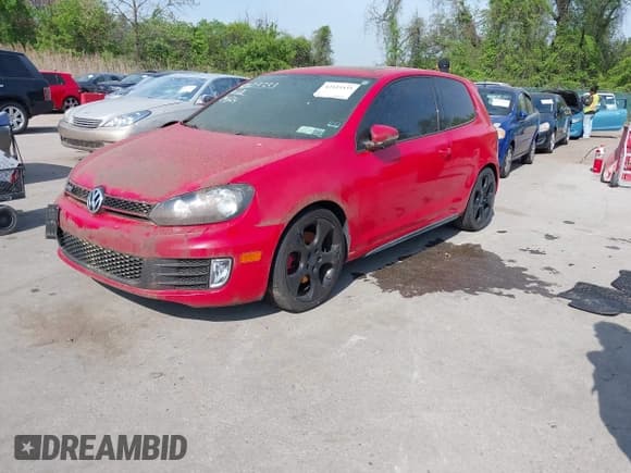 ✅ 2012 Volkswagen Golf GTI w/Conv & Sunroof • VIN: WVWEV7AJ2CW259338 • Lot: 42123333. Listed on IAAI with 121,365 mi. Free auction sales archive from the USA and detailed vehicle history report at DreamBid. Image 2.