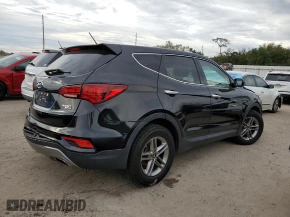 ✅ 2018 Hyundai Santa Fe 2.4L • VIN: 5NMZTDLB3JH077563 • Лот: 65330622. Опубликован ранее на Copart с пробегом 65 169 миль. Бесплатный доступ к архиву аукционных продаж из США и подробный отчёт об истории автомобиля на DreamBid. Изображение 3.