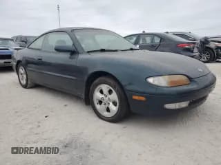 ✅ 1994 Mazda MX-6 • VIN: 1YVGE31D3R5179776 • Lot: 76675294. Wystawiony na Copart z przebiegiem 93 339 mil. Bezpłatny archiwum sprzedaży aukcyjnych z USA i szczegółowy raport historii pojazdu na DreamBid. Zdjęcie 4.